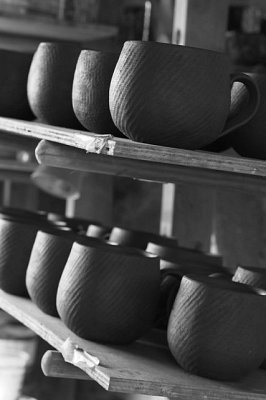 Shelf of cups in the workshop