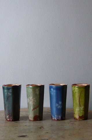 Four octagonal beakers